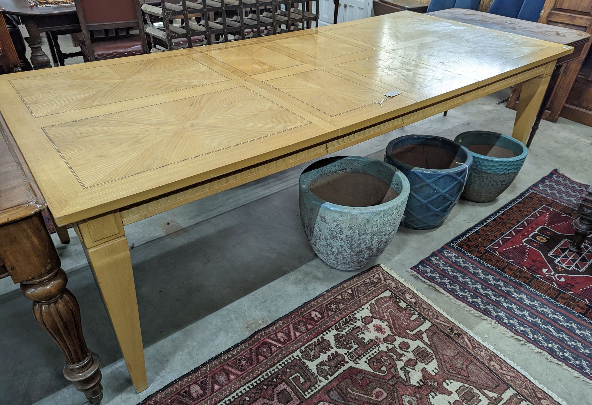 A contemporary inlaid oak extending dining table, 237cm extended, width 107cm, height 75cm